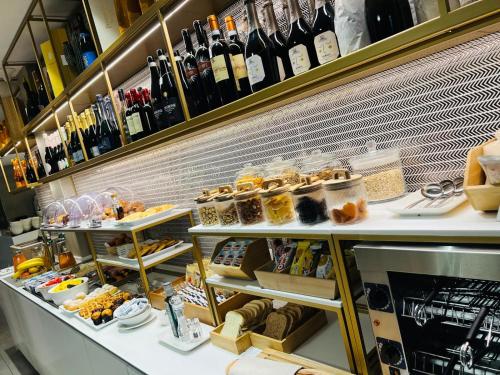 a store filled with lots of bottles of wine at Iris Hotel in Erbusco