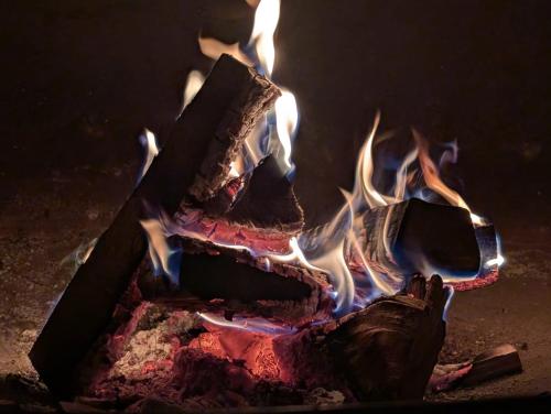 a fire is burning in a fire pit at Alagi ალაგი in Ambrolauri