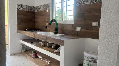 a bathroom with a sink in a room at Casa SaasNá, Departamento B, C y D in Cedro