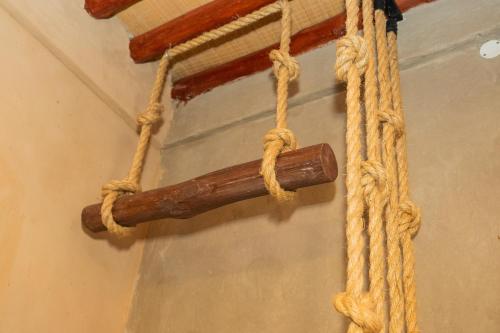 a bunch of ropes hanging from a ceiling at Al Jalilain Inn in Nizwa