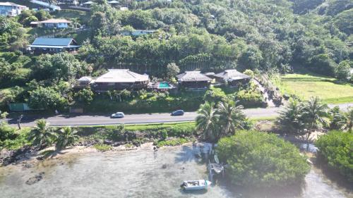 an aerial view of a house next to the water at Tehuarupe Surf Studio 2 in Haapiti