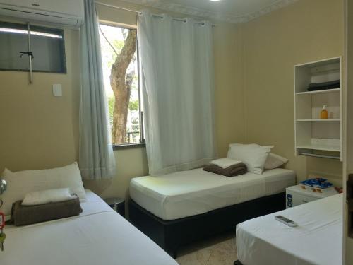 Postel nebo postele na pokoji v ubytování Quarto Aeroporto Galeão