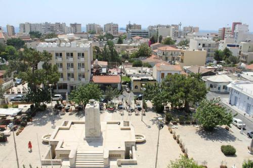 a view of a city with a monument in the center at Zouglas App Guesthouse in Limassol