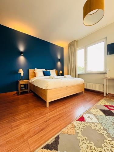 En eller flere senge i et værelse på Auberge Gourmande