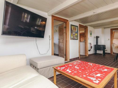 a living room with a tv and a coffee table at Panoramic View Fisherman's House - By Traum Ferienwohnungen in Vesløs