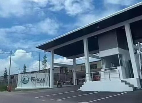 a large gas station with at Townixi Stay in Kampong Jelatang