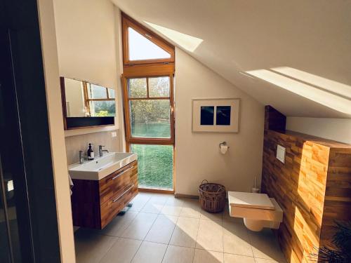 a bathroom with a sink and a window at Landhaus St Georgen im Gailtal in Emmersdorf