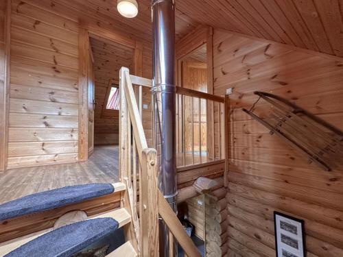 a log cabin with a spiral staircase in it at Bavaria in Teunz