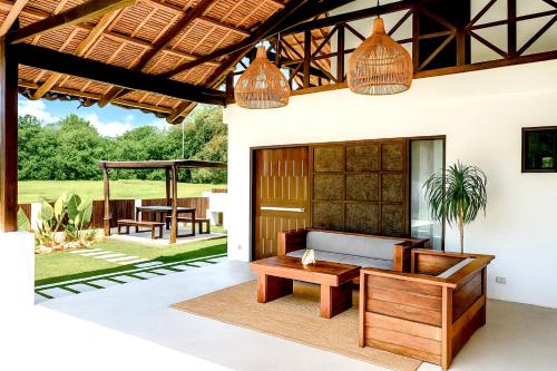a living room with a couch and a table at Secret Villa - Unique Experience in General Luna