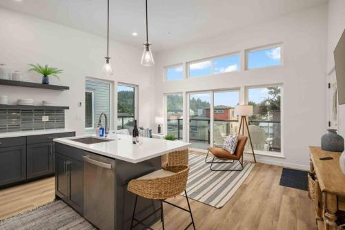 a kitchen with a sink and a counter at Ebb916 Modern Loft, Heart of Taft District, Walkable to Beach in Lincoln City