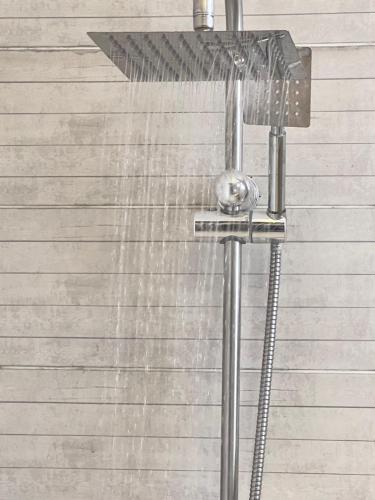 a shower with water coming out of it at Pyramids dream view in Cairo