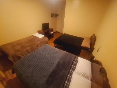 Voodi või voodid majutusasutuse Hotel Luis cordero centro historico cuenca toas