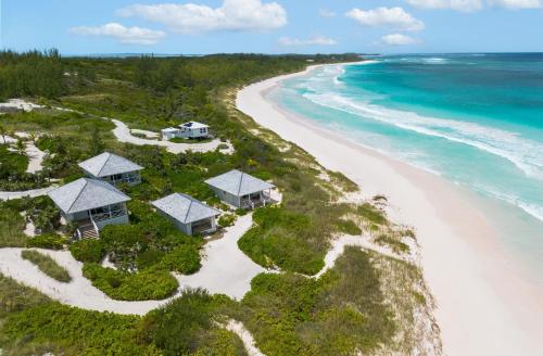 an aerial view of a resort on the beach at Bohemia Bungalow - Two home in James Cistern