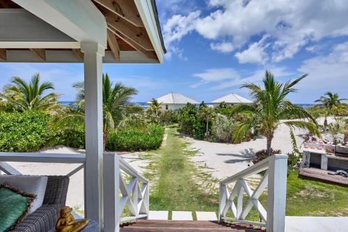 a view of the beach from the porch of a villa at Bohemia Two Bedroom home in James Cistern