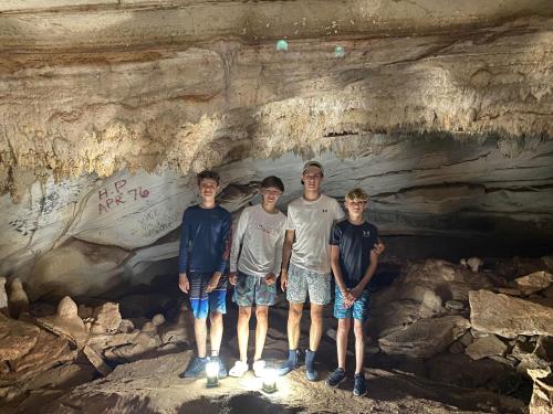 a group of people standing in a cave at Aqua Vista home in Palmetto Point