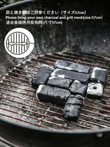 a bunch of black charcoal on a grill at WinVilla-Mt Fuji富士山 in Yamanakako