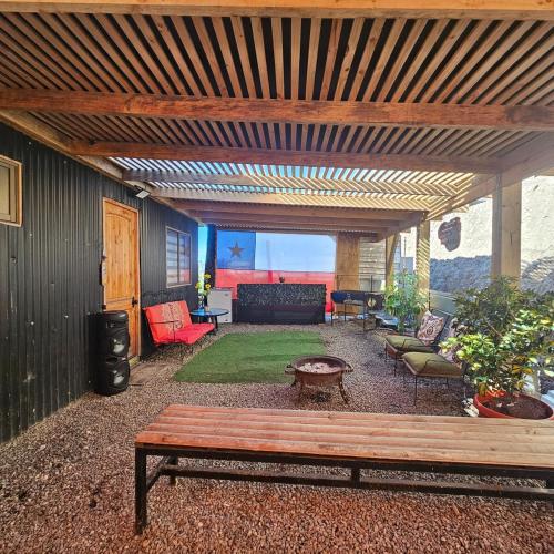 a living room with a couch and a bench at Cabaña Constitución in Constitución