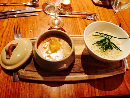 a tray with a bowl of soup on a table at Villa Bella Boutique Hotel in Kavadarci