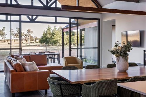 a living room with a couch and a table at The Cheese Factory - Luxe Design & Wine Country Calm in Cowaramup