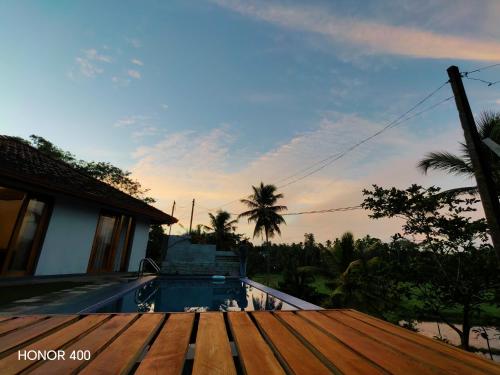 a view from the roof of a house with a swimming pool at Ely Field Villa in Galle