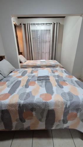 Postel nebo postele na pokoji v ubytování Velaz Guesthouse
