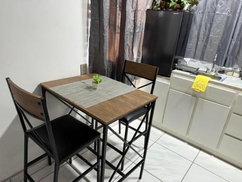 a dining room table and chairs in a kitchen at Brisa Serena in San Felipe