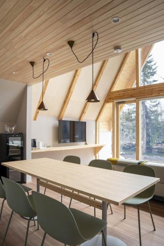 a dining room with a table and chairs at ERUSA Rusutsu in Rusutsu
