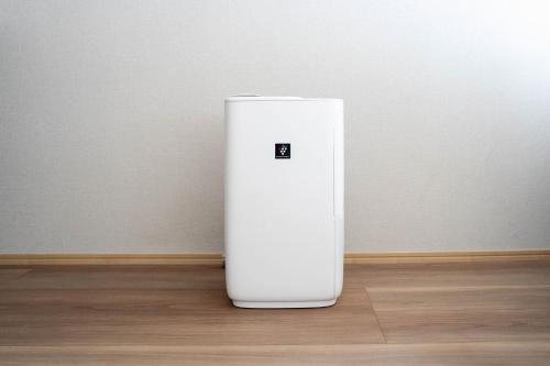 a white object sitting on the floor in a room at ERUSA Rusutsu in Rusutsu