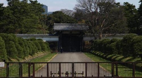 an entrance to a building with a black gate at Diamond Hotel Tokyo in Tokyo