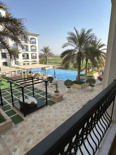 a view of the pool from the balcony of a hotel at F1 - Ivy Studio Golf View Ansam Yas Island, Theme Parks in Abu Dhabi