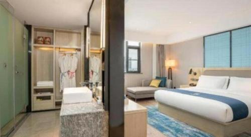 Ένα ή περισσότερα κρεβάτια σε δωμάτιο στο Echarm Hotel Jianshui Gucheng
