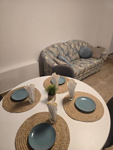 two plates on a table in a living room at Студио Ива 2 in Sliven