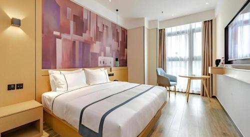 a hotel room with a large bed and a window at City Comfort Inn Chengdu Southwest University of Finance and Economics Wansheng Metro Station in Chengdu