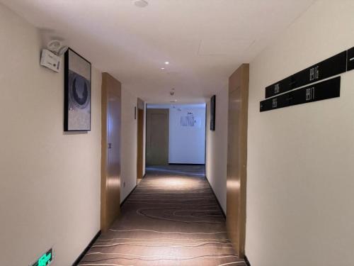 a hallway in a building with a hallway sidx sidx sidx at City Comfort Inn Shiyan Wudang Mountain in Danjiangkou
