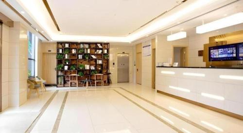 a lobby of a hospital with a tv and a waiting room at GreenTree Inn Linhai Jiangnan Avenue Express in Linhai