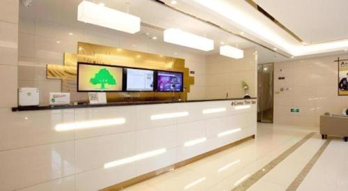 a lobby of a hospital with a tv on the wall at GreenTree Inn Linhai Jiangnan Avenue Express in Linhai
