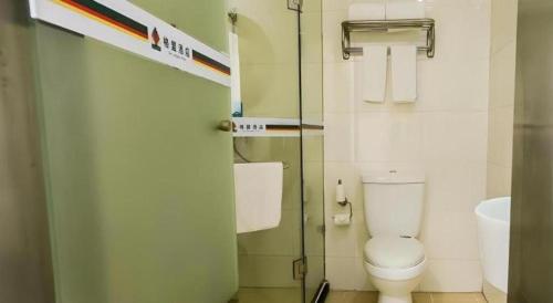 a small bathroom with a toilet and a sink at GreenTree Alliance Hotel Qinghuangdao Wanda Plaza in Qinhuangdao