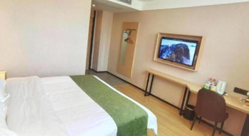 Ένα ή περισσότερα κρεβάτια σε δωμάτιο στο GreenTree Inn Express Chuzhou Langya District Government Chuhe Road