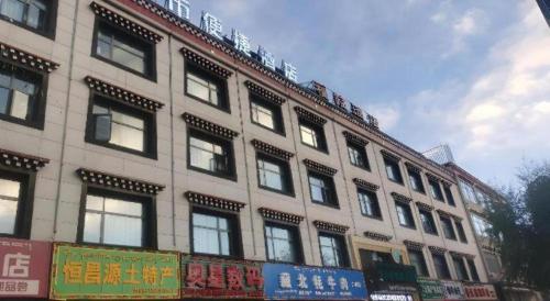 a large building with a lot of windows on it at City Comfort Inn Lhasa Potala Palace Scenic View in Lhasa