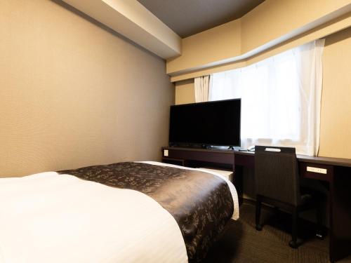 TV a/nebo společenská místnost v ubytování APA Hotel Chibachuo Ekimae