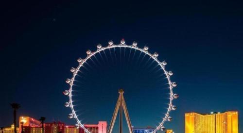 a large ferris wheel in a city at night at Ahern Hotel and Event Center in Las Vegas