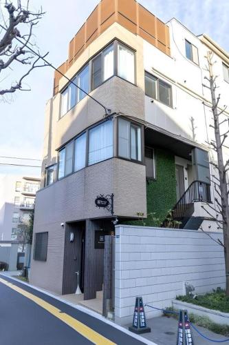 a building on a street with cones in front of it at HOSTEL LUND I -Oimachi- in Tokyo