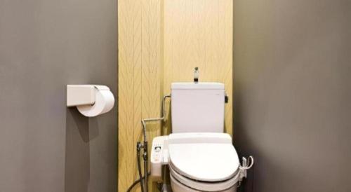 a bathroom with a white toilet in a room at HOSTEL LUND I -Oimachi- in Tokyo