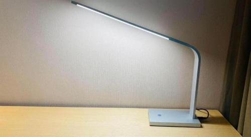 a lamp sitting on top of a wooden table at Lavande Hotel Changchun Gaoxin Jilin University in Changchun