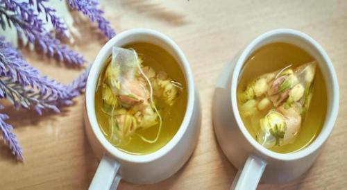 two cups of soup on a wooden table at Lavande Hotel Changchun Gaoxin Jilin University in Changchun