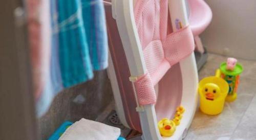 a toy toilet with a toy duck in a bathroom at Xiamen Seashine Lakeview Hotel in Xiamen