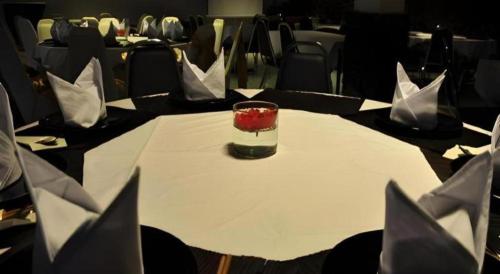 a table with a glass on top of a table at Piyaporn Hill Paradise Hotel in Mae Sai