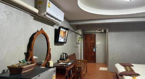 TV o dispositivi per l'intrattenimento presso Jirawan Hotel