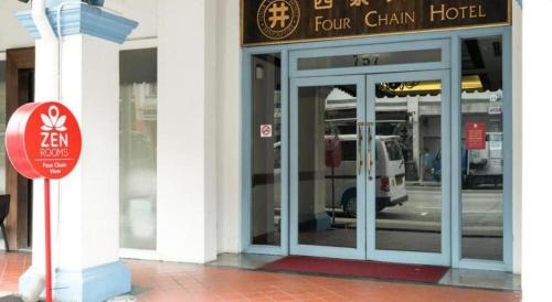 a front door of a building with a sign on it at Four Chain View Hotel in Singapore