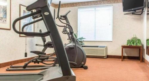 a room with a gym with a treadmill at Quality Inn in Geneseo